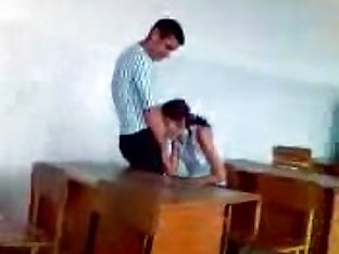 Young couple caugth in the classroom